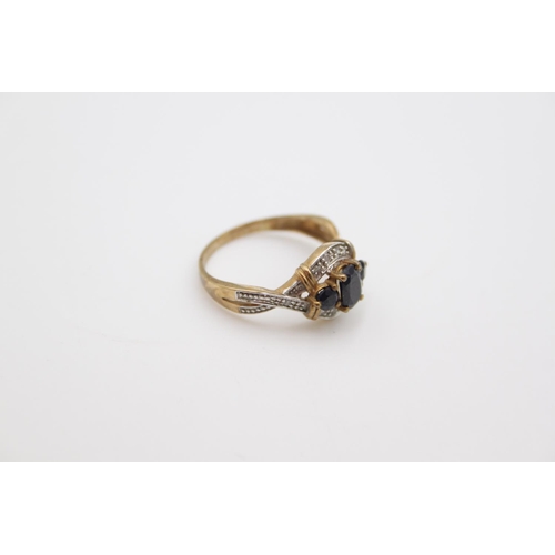 180 - A hallmarked Birmingham 9ct gold sapphire and diamond ring, size O - approx. gross weight 2.6 grams