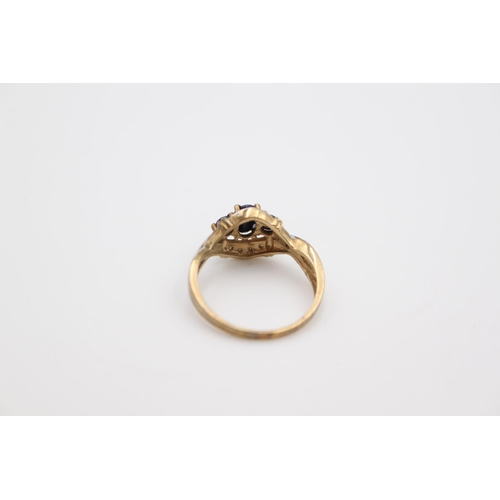 180 - A hallmarked Birmingham 9ct gold sapphire and diamond ring, size O - approx. gross weight 2.6 grams