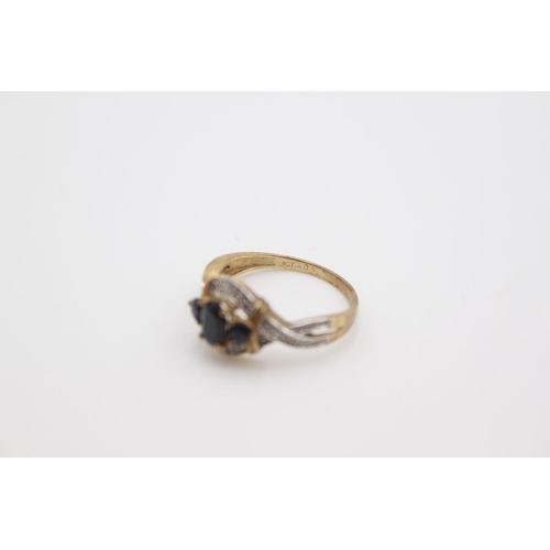 180 - A hallmarked Birmingham 9ct gold sapphire and diamond ring, size O - approx. gross weight 2.6 grams