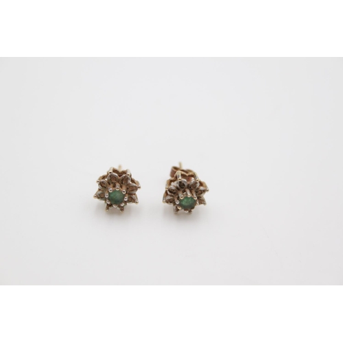 182 - A pair of hallmarked Birmingham 9ct gold diamond and emerald cluster stud earrings - approx gross we... 