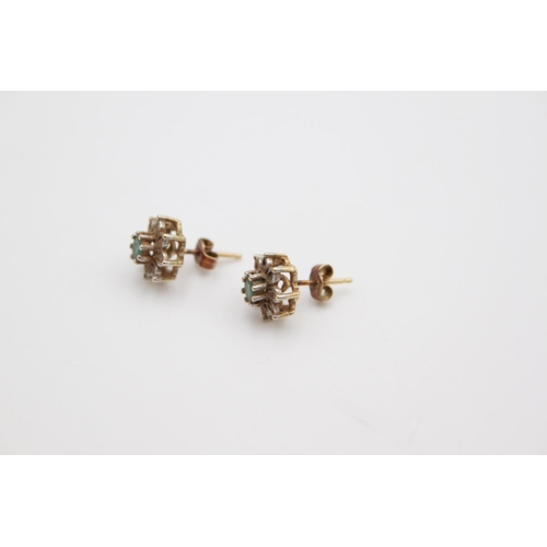 182 - A pair of hallmarked Birmingham 9ct gold diamond and emerald cluster stud earrings - approx gross we... 