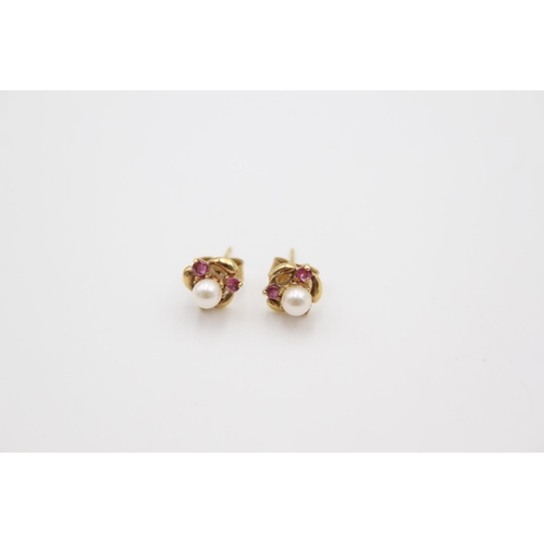 192 - A pair of 9ct gold ruby and pearl stud earrings - approx. gross weight 1.1 grams