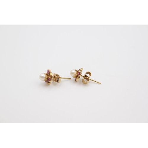 192 - A pair of 9ct gold ruby and pearl stud earrings - approx. gross weight 1.1 grams