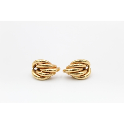 218 - A pair of 9ct gold abstract swirl stud earrings - approx. gross weight 3.5 grams