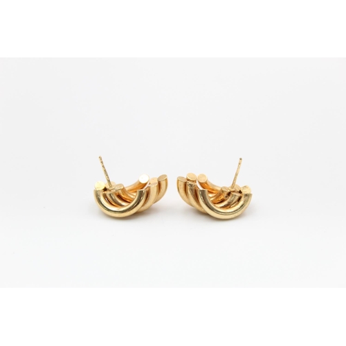 218 - A pair of 9ct gold abstract swirl stud earrings - approx. gross weight 3.5 grams