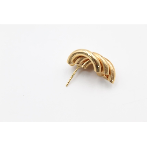 218 - A pair of 9ct gold abstract swirl stud earrings - approx. gross weight 3.5 grams