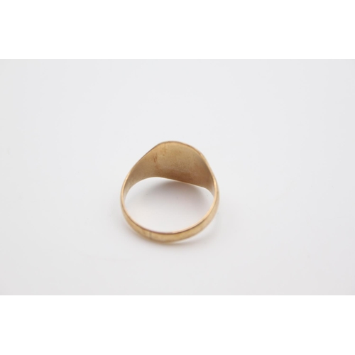 9 - A 9ct gold cushion signet ring, size S ½ - approx. gross weight 4.4 grams