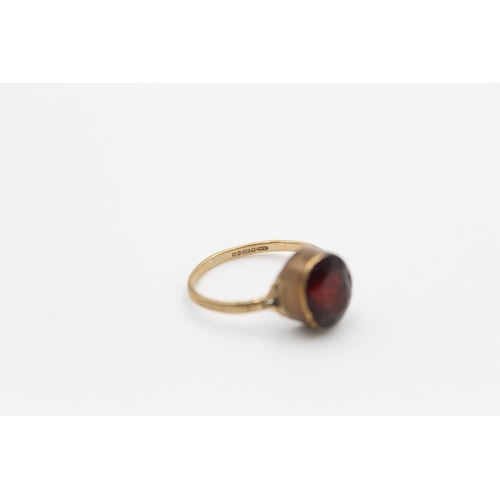 111 - A hallmarked Birmingham 9ct gold garnet soltiaire ring, size L  - approx. gross weight 3 grams