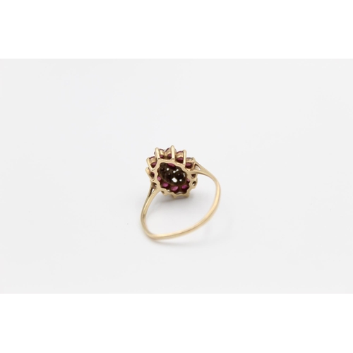 137 - A 9ct gold ruby and diamond cluster ring, size O ½  - approx. gross weight 2.2 grams