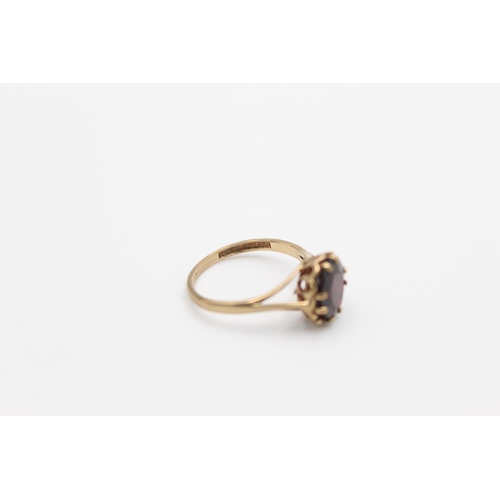 145 - A hallmarked Birmingham 9ct gold garnet solitaire ring, size Q - approx. gross weight 2.6 grams