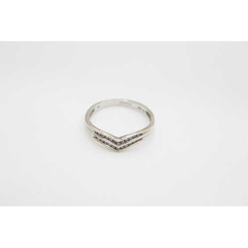 95 - A hallmarked Birmingham 9ct white gold diamond double chevron ring - approx. gross weight 1.7 grams,... 