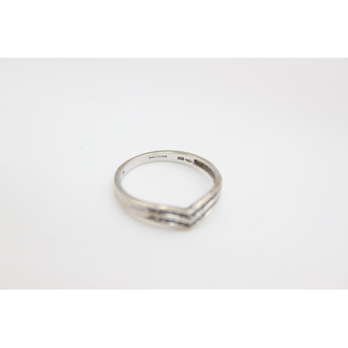 95 - A hallmarked Birmingham 9ct white gold diamond double chevron ring - approx. gross weight 1.7 grams,... 