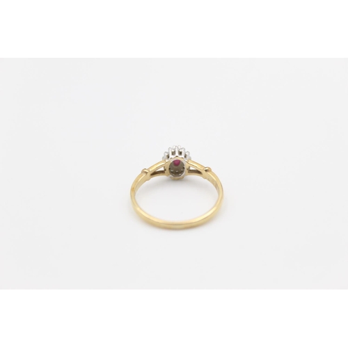 119 - A 9ct gold diamond and ruby halo ring, size P ½ - approx. gross weight 2.1 grams