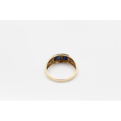 124 - A 9ct gold diamond and sapphire ring, size Q - approx. gross weight 2.4 grams