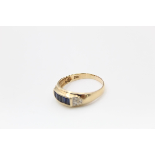 124 - A 9ct gold diamond and sapphire ring, size Q - approx. gross weight 2.4 grams