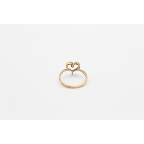 153 - A 9ct gold diamond love heart ring, size G - approx. gross weight 1.1 grams