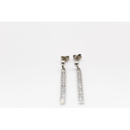 185 - A pair of 9ct white gold CZ set bar drop earrings - approx. gross weight 1.7 grams