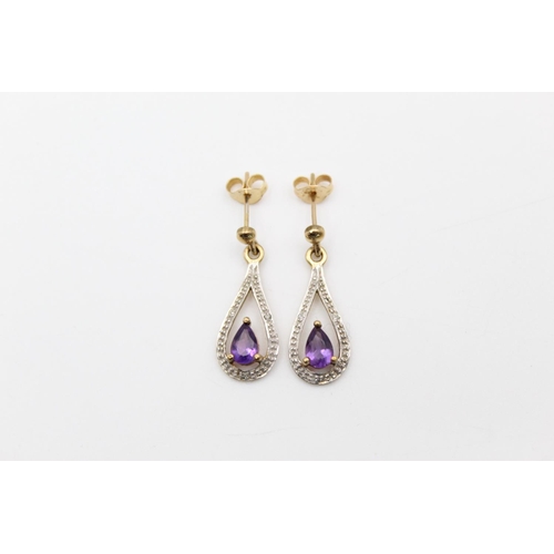 188 - A pair of 9ct gold diamond and amethyst drop earrings - approx. gross weight 2.3 grams