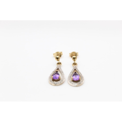 188 - A pair of 9ct gold diamond and amethyst drop earrings - approx. gross weight 2.3 grams