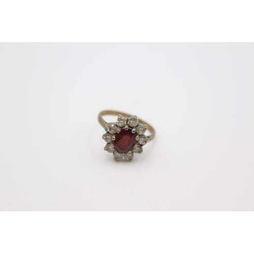 62 - A 9ct garnet set cluster dress ring, size L - approx. gross weight 3 grams