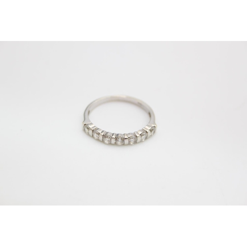 65 - A 9ct white gold gemstone half eternity ring - approx. gross weight 2.2 grams, size R