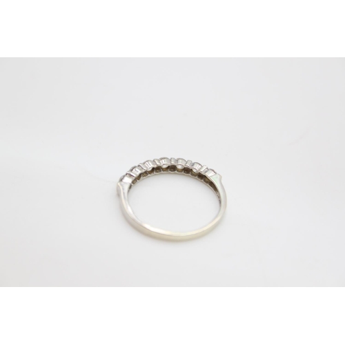 65 - A 9ct white gold gemstone half eternity ring - approx. gross weight 2.2 grams, size R