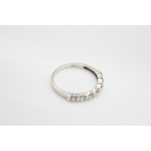 65 - A 9ct white gold gemstone half eternity ring - approx. gross weight 2.2 grams, size R