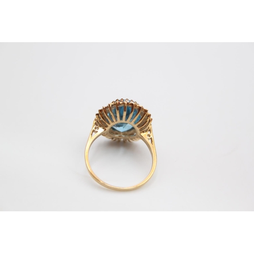 66 - A 9ct gold aquamarine paste halo ring, size Q ½ - approx. gross weight 4.4 grams