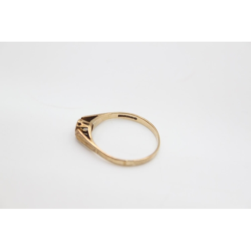 67 - A hallmarked Birmingham 9ct gold diamond soltiaire ring, size Q ½ - approx. gross weight 1.5 grams