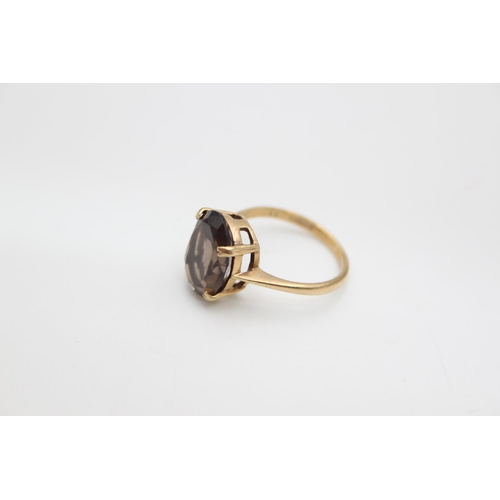 69 - A hallmarked Edinburgh 9ct gold smoky quartz set cocktail ring, size N ½ - approx. gross weight 3.3 ... 