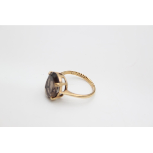 69 - A hallmarked Edinburgh 9ct gold smoky quartz set cocktail ring, size N ½ - approx. gross weight 3.3 ... 