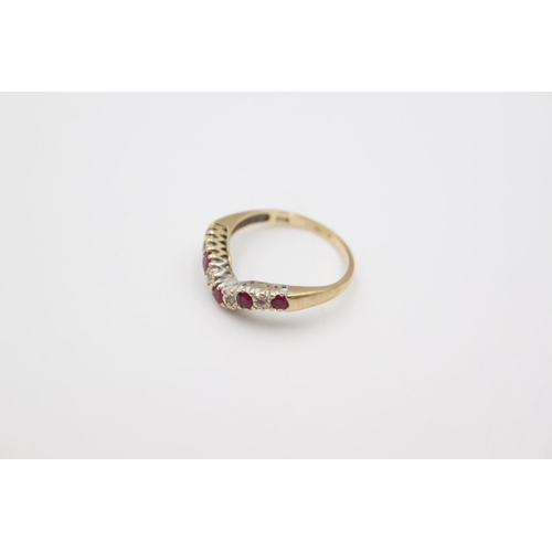 71 - A stamped 375 yellow metal ruby and diamond set half eternity wishbone ring, size N ½ - approx. 2.3 ... 