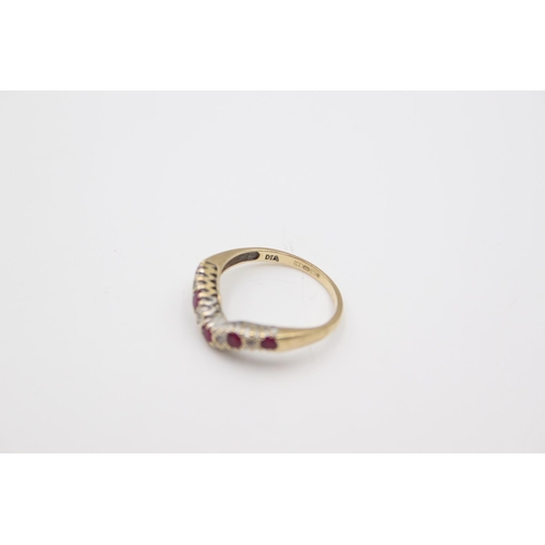 71 - A stamped 375 yellow metal ruby and diamond set half eternity wishbone ring, size N ½ - approx. 2.3 ... 