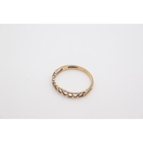 72 - A 9ct gold heart and teardrops half eternity band ring, size R ½  - approx. gross weight 1 gram