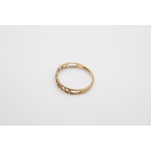 72 - A 9ct gold heart and teardrops half eternity band ring, size R ½  - approx. gross weight 1 gram