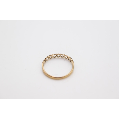 72 - A 9ct gold heart and teardrops half eternity band ring, size R ½  - approx. gross weight 1 gram