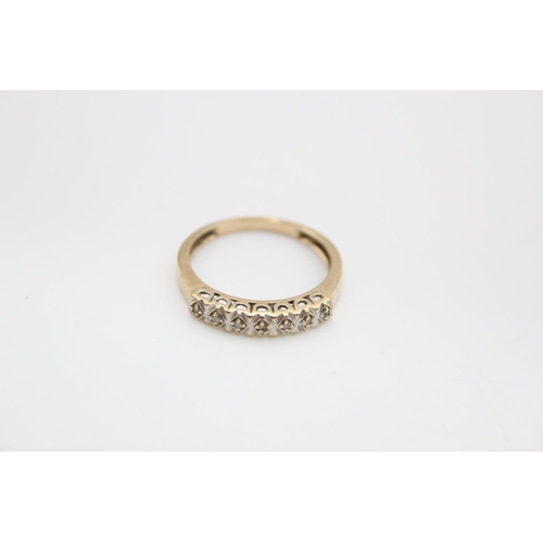 76 - A 9ct gold diamond set half eternity ring, size P - approx. gross weight 2.1 grams