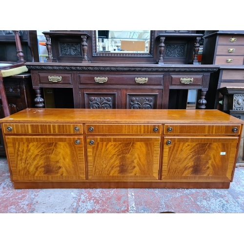 1089 - A late 20th century Regency style flame mahogany sideboard with three doors and three drawers  - app... 