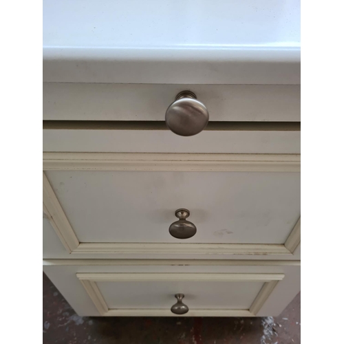 1091 - A pair of white laminate bedside chests of two drawers -  approx. 60cm high x 42cm wide x 50cm deep