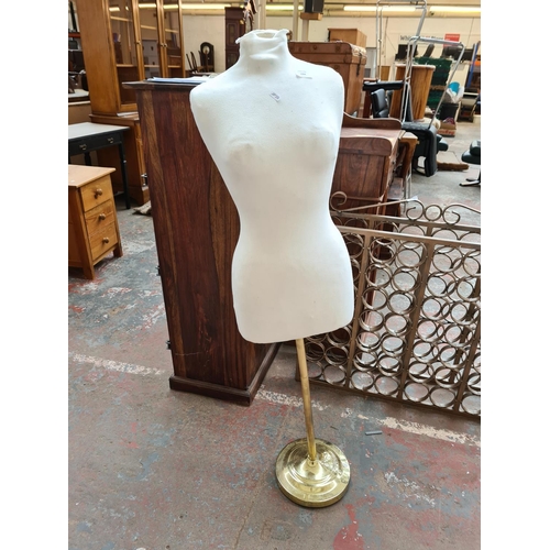 1094 - A modern white female mannequin on brass effect base