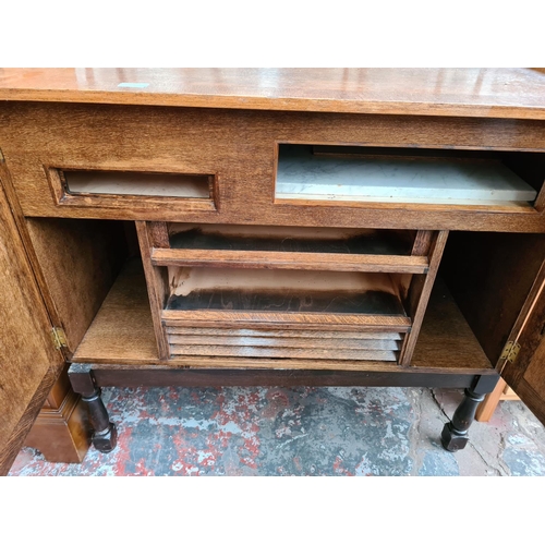 1097 - A vintage oak media cabinet with two doors and later added stand - approx. 86cm high x 94cm wide x 5... 