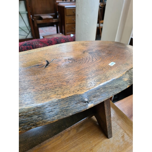 1102 - An oak tree slice coffee table - approx. 36cm high x 132cm wide x 32cm deep