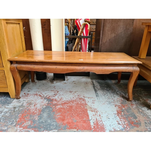 1105 - An Oriental style elm rectangular coffee table - approx. 45cm high x 127cm wide x 46cm deep