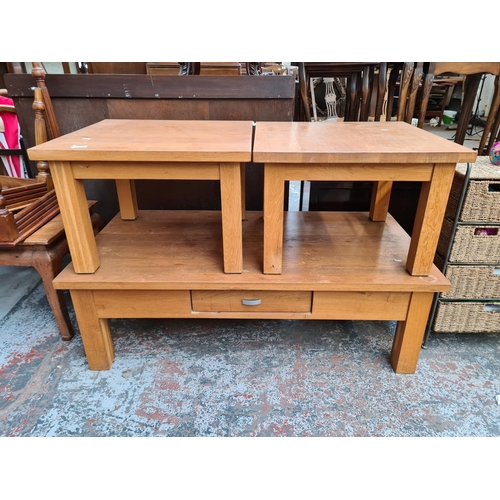 1106 - A modern oak rectangular coffee table with one drawer and two matching side tables