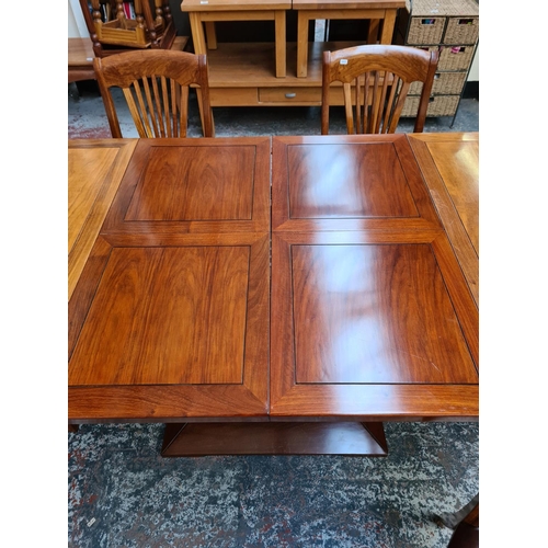 1108 - A Starbay Amiral rosewood veneer louvered pedestal extending dining table with two extension leaves,... 