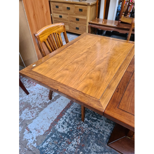 1108 - A Starbay Amiral rosewood veneer louvered pedestal extending dining table with two extension leaves,... 