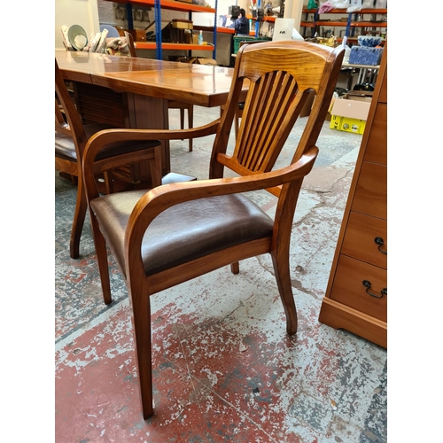 1108 - A Starbay Amiral rosewood veneer louvered pedestal extending dining table with two extension leaves,... 