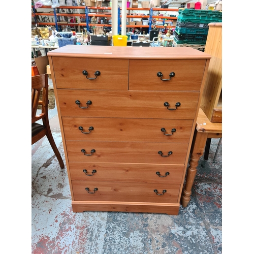 1109 - A modern pine effect chest of two short over five long drawers - approx. 112cm high x 78.5cm wide x ... 