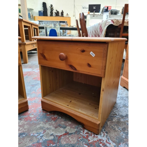 1110 - A pair of modern pine bedside cabinets with one drawer - approx. 51cm high x 46.5cm wide x 44cm deep