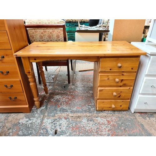 1111 - A modern pine desk with four drawers - approx. 76cm high x 122cm wide x 56cm deep